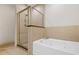 Bathroom featuring separate shower and tub, complemented by neutral tile at 1199 Lavista Ne Rd, Atlanta, GA 30324