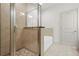Bathroom showcasing separate shower and tub, complemented by neutral tile at 1199 Lavista Ne Rd, Atlanta, GA 30324