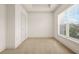 Bedroom features carpeting, white walls, window, and tray ceiling at 1199 Lavista Ne Rd, Atlanta, GA 30324