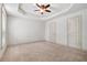 Bedroom with neutral carpeting, two doors, and a fan at 1199 Lavista Ne Rd, Atlanta, GA 30324