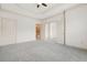 Spacious carpeted bedroom featuring tray ceiling and neutral color scheme at 1199 Lavista Ne Rd, Atlanta, GA 30324