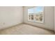 Bedroom with neutral carpeting and a large window overlooking the neighborhood at 1199 Lavista Ne Rd, Atlanta, GA 30324