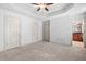 Bright bedroom featuring neutral walls and carpeting, and a view to an ensuite bathroom at 1199 Lavista Ne Rd, Atlanta, GA 30324