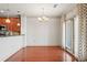 Inviting dining space with wood floors, stylish lighting, and a seamless connection to the kitchen, perfect for entertaining at 1199 Lavista Ne Rd, Atlanta, GA 30324