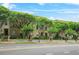Charming townhomes featuring brick exteriors, mature trees, and inviting entrances along a quiet street at 1199 Lavista Ne Rd, Atlanta, GA 30324