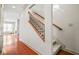 Hallway featuring hardwood floors, stairs to the second floor, and views into the living spaces at 1199 Lavista Ne Rd, Atlanta, GA 30324