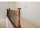Hallway with a carpeted floor and railings to the stairs at 1199 Lavista Ne Rd, Atlanta, GA 30324