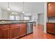 The kitchen area features granite countertops, tile backsplash, stainless steel appliances, and a view into the living space at 1199 Lavista Ne Rd, Atlanta, GA 30324