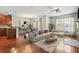 Open-concept living room with hardwood floors, modern furniture, and a cozy fireplace at 1199 Lavista Ne Rd, Atlanta, GA 30324