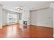 Spacious living room with warm wood floors, fireplace, and large windows providing natural light and a cozy atmosphere at 1199 Lavista Ne Rd, Atlanta, GA 30324