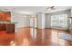 Bright, open-concept living space featuring wood floors, updated appliances, a ceiling fan, and large windows at 1199 Lavista Ne Rd, Atlanta, GA 30324
