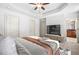 Comfortable bedroom features soft carpet, recessed ceiling, tv and convenient access to ensuite bathroom at 1199 Lavista Ne Rd, Atlanta, GA 30324
