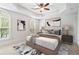 Serene main bedroom showcases tray ceilings, arched windows, and neutral decor for a peaceful retreat at 1199 Lavista Ne Rd, Atlanta, GA 30324