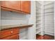 A butler's pantry with wooden cabinets, counter space, and an open, walk-in shelved storage area at 1199 Lavista Ne Rd, Atlanta, GA 30324