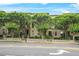 Charming townhomes line the street, adorned with mature trees and inviting entrances, creating a picturesque neighborhood setting at 1199 Lavista Ne Rd, Atlanta, GA 30324