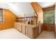 Attic space with wood paneling, built-in cabinets and natural lighting would be great for storage at 6596 Wright Ne Rd, Atlanta, GA 30328