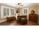 Inviting bedroom with hardwood floors, natural light, and vintage-style furnishings at 6596 Wright Ne Rd, Atlanta, GA 30328