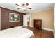 Spacious bedroom with a hardwood floor, ceiling fan, and neutral color scheme at 6596 Wright Ne Rd, Atlanta, GA 30328