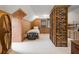Bedroom boasts wood paneling, exposed brick, and natural light, creating a unique and inviting space at 6596 Wright Ne Rd, Atlanta, GA 30328