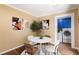 Cozy breakfast nook featuring a round table and chairs, next to a laundry closet with stacked washer and dryer at 6596 Wright Ne Rd, Atlanta, GA 30328