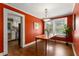 Charming dining room with a wooden table and stylish decor, featuring a view into the adjacent kitchen at 6596 Wright Ne Rd, Atlanta, GA 30328
