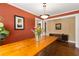 Classic dining room with a wooden table, hardwood floors, and elegant lighting fixtures, creating a cozy atmosphere at 6596 Wright Ne Rd, Atlanta, GA 30328
