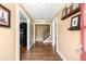 Inviting foyer showcasing hardwood floors, fresh paint, elegant trim, and a staircase at 6596 Wright Ne Rd, Atlanta, GA 30328