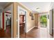Foyer showcasing hardwood floors leading to the dining room and an open doorway to the exterior at 6596 Wright Ne Rd, Atlanta, GA 30328