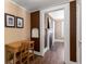 Hallway view leading to a bedroom with hardwood floors and a decorative fireplace at 6596 Wright Ne Rd, Atlanta, GA 30328