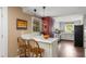 Kitchen featuring tiled countertops, a breakfast bar with seating, and stainless steel appliances at 6596 Wright Ne Rd, Atlanta, GA 30328