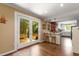 Bright and airy kitchen with a breakfast bar overlooking an outdoor patio with lush greenery at 6596 Wright Ne Rd, Atlanta, GA 30328