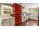 Well-lit kitchen with stainless steel appliances, custom cabinetry and a large window offering natural light at 6596 Wright Ne Rd, Atlanta, GA 30328