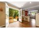Open concept kitchen with a breakfast bar and adjacent patio with views of the backyard at 6596 Wright Ne Rd, Atlanta, GA 30328