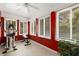 Bright sunroom filled with natural light, multiple windows, and exercise equipment at 6596 Wright Ne Rd, Atlanta, GA 30328