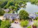 Panoramic aerial shot of lakefront properties showcasing lush greenery and a peaceful waterfront at 705 Berry Ct, Villa Rica, GA 30180