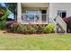 Charming outdoor patio with access stairs, surrounded by lush rose bushes and landscaping at 705 Berry Ct, Villa Rica, GA 30180