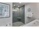 Bathroom featuring a walk-in shower with glass door, modern fixtures, and a white vanity at 705 Berry Ct, Villa Rica, GA 30180