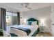 Cozy bedroom with a large window, grey curtains, comfortable bed and stylish side tables at 705 Berry Ct, Villa Rica, GA 30180