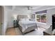 Comfortable bedroom with a trey ceiling, large window, and neutral walls at 705 Berry Ct, Villa Rica, GA 30180