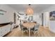 Bright dining area with a round table and seating for four, with views of the kitchen and living area at 705 Berry Ct, Villa Rica, GA 30180