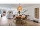 Cozy dining area featuring stylish lighting, seating for four, and an open concept layout leading to the living room at 705 Berry Ct, Villa Rica, GA 30180