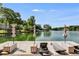 Inviting lake dock with lounge chairs and umbrellas for enjoying waterfront relaxation at 705 Berry Ct, Villa Rica, GA 30180