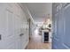Inviting entryway with a wine fridge transitions to an open-concept living space with hardwood floors and lots of natural light at 705 Berry Ct, Villa Rica, GA 30180