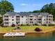 Charming condo complex with boat dock access, manicured lawn, and lake views at 705 Berry Ct, Villa Rica, GA 30180