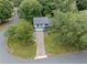 Charming home with a driveway and two-car garage nestled among lush green trees in a cul-de-sac at 9760 Loblolly Ln, Roswell, GA 30075