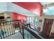Inviting two-story foyer features beautiful hardwood floors and a grand staircase leading to the upper level at 9760 Loblolly Ln, Roswell, GA 30075