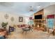 Comfortable living room showcasing a stone fireplace, large TV, and neutral decor at 9760 Loblolly Ln, Roswell, GA 30075