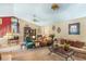 Spacious living room featuring neutral tones, carpet, and access to staircase at 9760 Loblolly Ln, Roswell, GA 30075