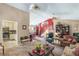 Spacious living room featuring a staircase, home office, and open access to the kitchen at 9760 Loblolly Ln, Roswell, GA 30075