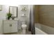Modern bathroom featuring a vanity with storage and a shower-tub combo with tile surround at 1818 Butterfly Way, Marietta, GA 30066